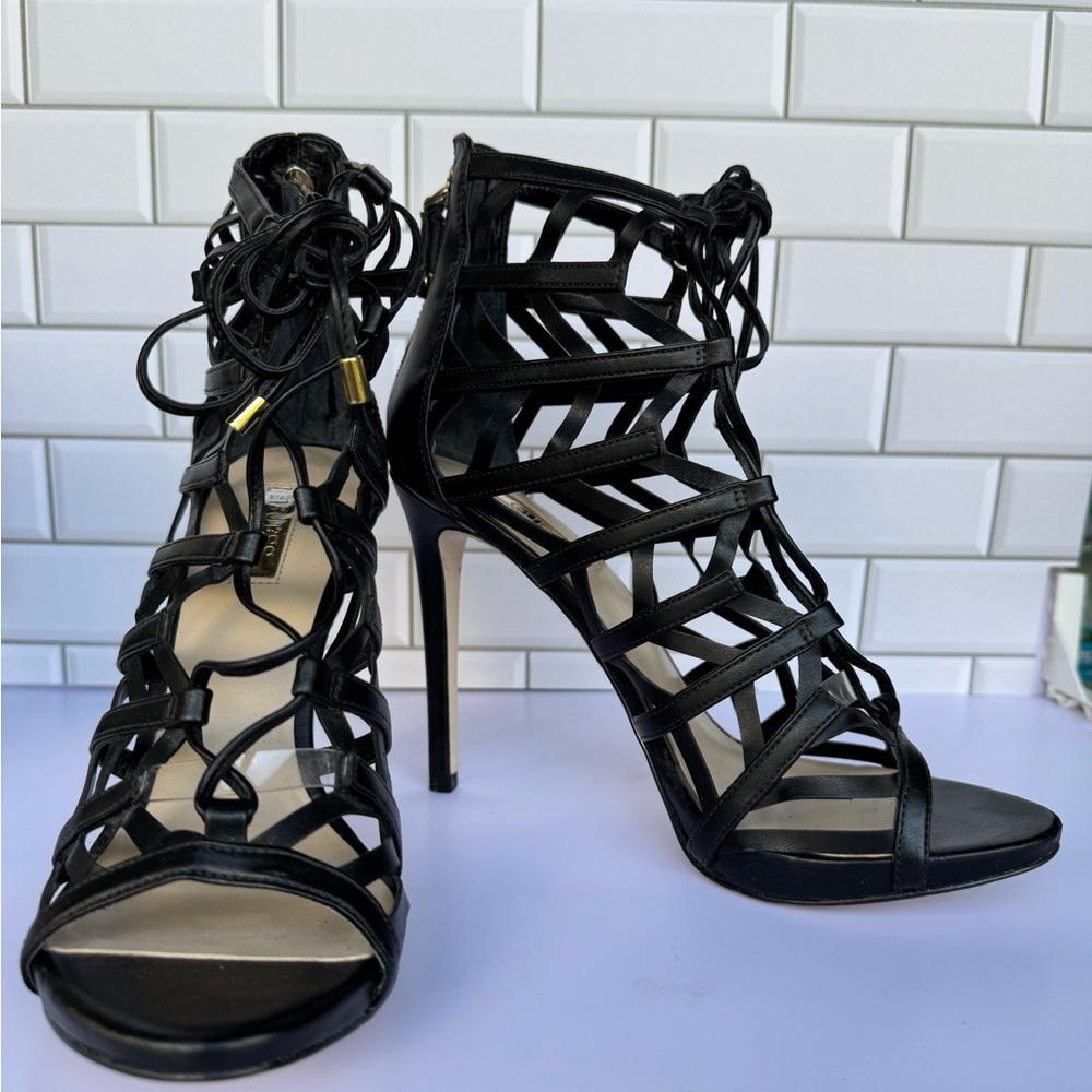 Black Stiletto Heels with Intricate Cut-Out Design